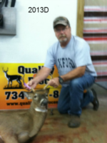 Man holding killed buck