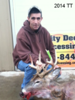 Man holding killed buck