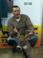 Man holding killed buck