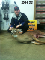 Man holding killed buck