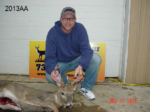 Man holding killed buck