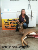 Man holding killed buck