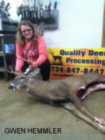 Man holding killed buck