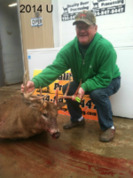 Man holding killed buck