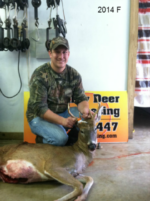 Man holding killed buck