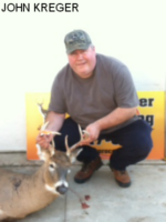 Man holding killed buck