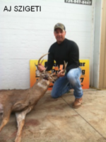 Man holding killed buck
