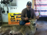 Man holding killed buck