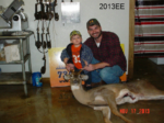 Man and boy holding killed buck