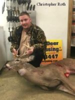 Man holding killed buck