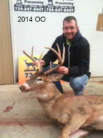 Man holding killed buck