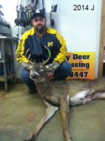 Man holding killed buck
