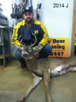 Man holding killed buck