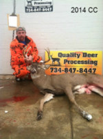 Man holding killed buck