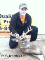 Man holding killed buck