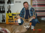 Man holding killed buck