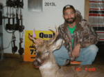 Man holding killed buck