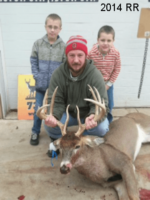 Man holding killed buck
