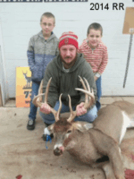 Man holding killed buck
