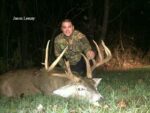 Man holding killed buck