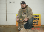 Man holding killed buck
