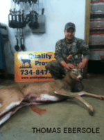 Man holding killed buck