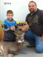 Man holding killed buck