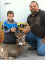 Man holding killed buck