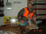 Man holding killed buck