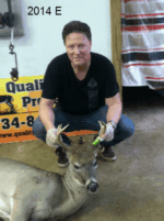 Man holding killed buck