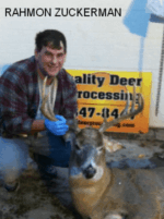 Man holding killed buck