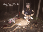 young girl holding killed buck