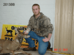Man holding killed buck