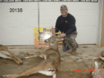 Man holding killed buck