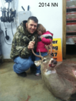 Man holding killed buck