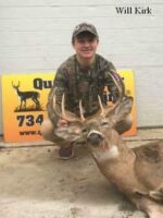 Man holding killed buck