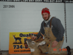 Man holding killed buck