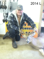 Man holding killed buck