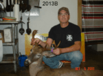 Man holding killed buck