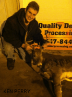 Man holding killed buck