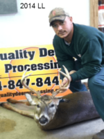 Man holding killed buck
