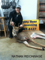 Man holding killed buck