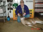 Man holding killed buck