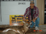 Man holding killed buck